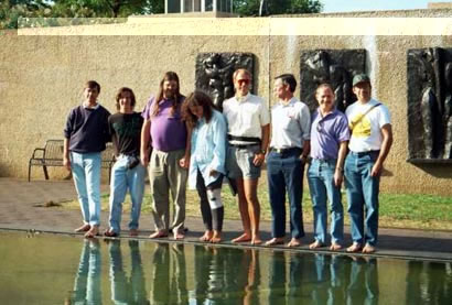 Barefooters at a Reflecting Pool in a Sculpture Garden