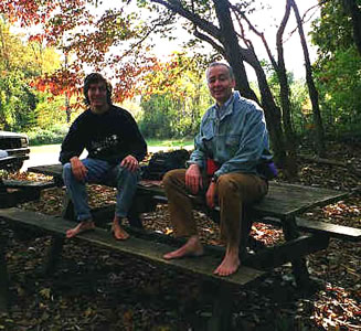 Barefoot Chris and Barefoot Christian Relax on a Picnic Table after the hike